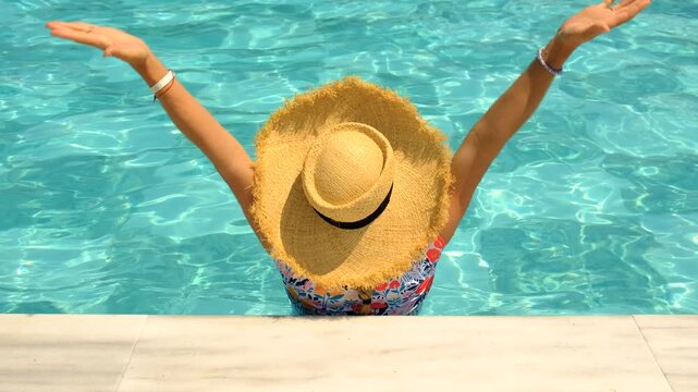 Woman in hat in swimming pool. selective focus.