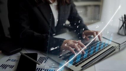 A business professional is engaged in financial data analysis on a laptop, showcasing digital graphics that highlight stock market trends and performance metrics. Copula
