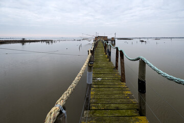 Obraz premium Comacchio Valleys, Ferrara, Italy - Views of huts and fishing boats in the Romagna lagoon
