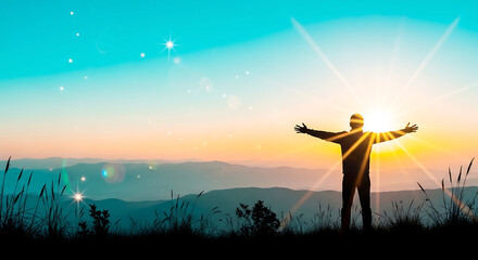 A man stands in a serene landscape with arms outstretched towards a vibrant sunset