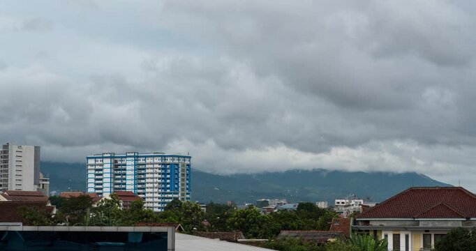 Timelapse of thick clouds rolling over the hills in Bandung, Indonesia