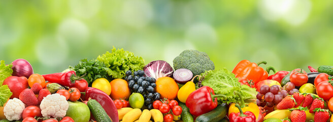 Assorted Fresh Fruits and Vegetables Banner on Natural Green Background with Copy Space for Nutrition, Diet and Wellness Concepts