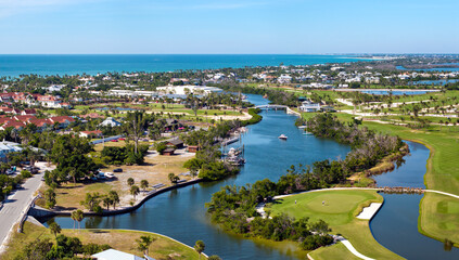 American waterfront houses in rural US suburbs. View from above of large residential homes in island small town Boca Grande on Gasparilla Island in southwest Florida © bilanol