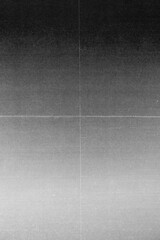 Fototapeta premium Abstract grayscale background with subtle grain texture, soft gradient tones, and visible fold and scratch lines. The image has a vintage paper and film scan aesthetic.
