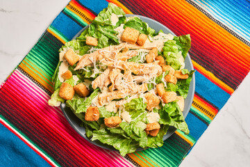 Classic caesar salad with grilled chicken fillet and parmesan cheese.