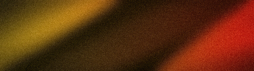 Fototapeta premium Abstract wide grainy background with blurred gradients of gold, brown, orange, red, and black. A textured banner perfect for luxury branding and warm designs
