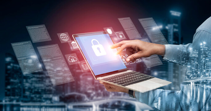 This image showcases technology and cybersecurity concepts with a lock icon on a laptop screen, set against a futuristic night cityscape backdrop. Gantry - Powered by Adobe