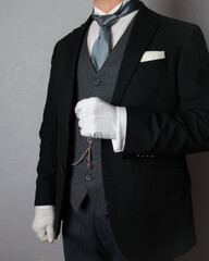 Butler or Hotel Concierge in Formal Attire and White Gloves Eager to Be of Service. Professional Hospitality and Courtesy.