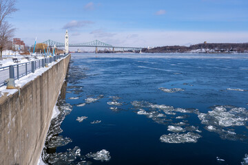 Old Port Clock Tower and Saint Lawrence River with ice chunks