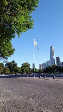 Argentine flag waving on a flagpole. Sunny day in Argentina, with an imposing Argentine flag waving