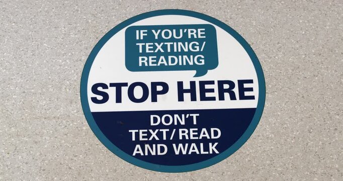 Work safety information sign walking texting reading in corridors walkways