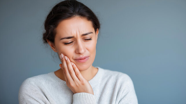 Faceless girl suffering from severe tooth pain dental discomfort oral health emergency toothache experience mouth pain condition emergency dental care needy with copy space