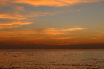 Obraz premium Sky and clouds after sunset and sea is calm in the evening.