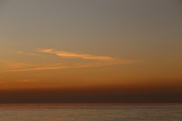Fototapeta premium Sky and clouds after sunset and sea is calm in the evening.