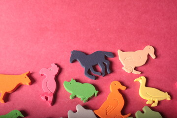 animals toys on a red background