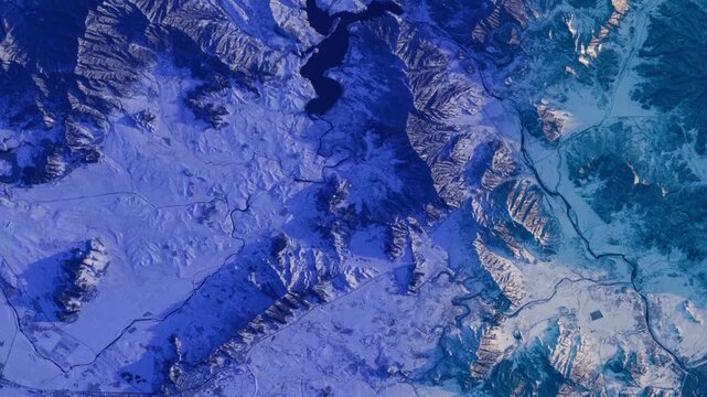 Snow covered mountain landscape at sunrise, abstract satellite view background animation based on NASA imagery
