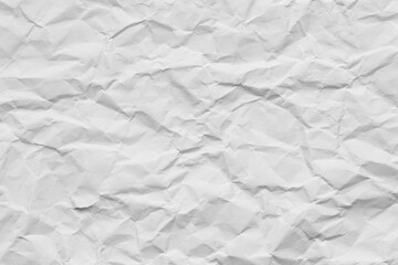 Obraz premium Crumpled white paper texture background,A high-resolution top view of a wrinkled and crumpled piece of white paper, showing detailed creases, shadows, and textures, ideal for background or overlay.