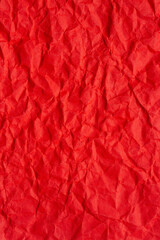Fototapeta premium Crumpled red paper texture background,Macro,Close-up top view of vibrant red crumpled paper texture. Abstract background with wrinkled and creased paper surface, perfect for creative designs, 