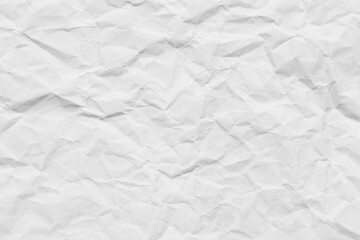Obraz premium Crumpled white paper texture background,A high-resolution top view of a wrinkled and crumpled piece of white paper, showing detailed creases, shadows, and textures, ideal for background or overlay.