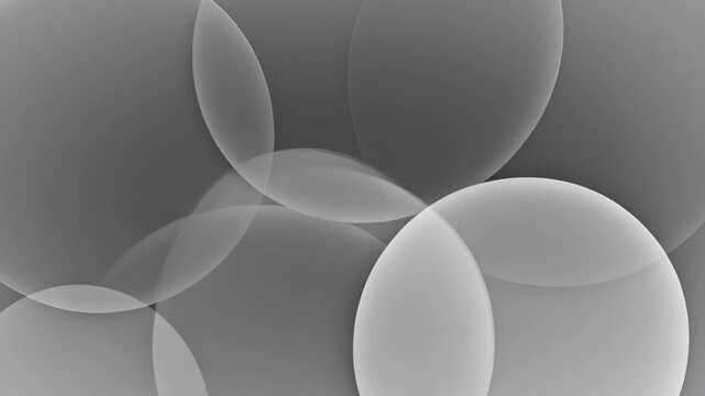 Abstract grayscale composition with overlapping translucent circles and soft lighting