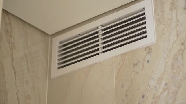 Modern Air Vent Grille in Clean Interior Wall Corner, Essential HVAC System Component for Dynamic Climate Control and Airflow.