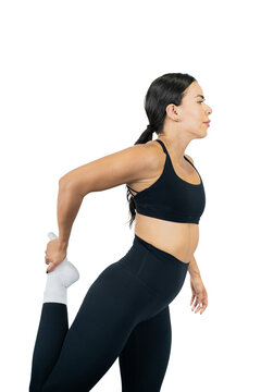 Young woman in activewear stretching her leg, promoting health and wellness
