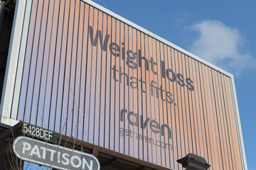 Obraz premium roadside billboard for Raven, a non‑prescription supplement brand marketed for metabolism or appetite support, Toronto