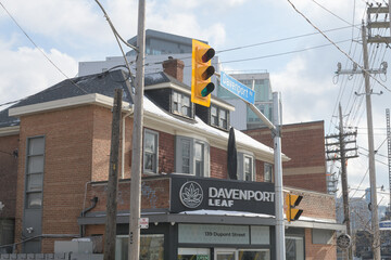 Obraz premium exterior building facade and sign of Davenport Leaf, a cannabis store, located at 139 Dupont St, Toronto