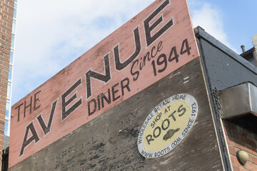 Obraz premium old painted sign outside Avenue Diner, a restaurant, located at 222 Davenport Rd, Toronto