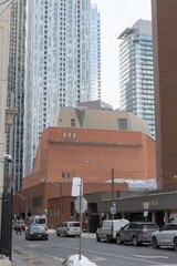 Naklejka premium looking west on Asquith Av to the bulky brick building of Toronto Public Library - Toronto Reference Library, and towers in the Bloor Yorkville area