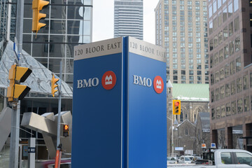 Naklejka premium roadside sign for BMO Bank of Montreal branch at 120 Bloor St E, Toronto (looking east on Bloor E at Church St)