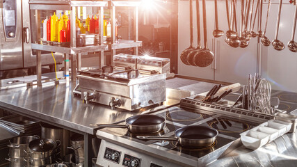 Modern Restaurant Kitchen with Professional Equipment. Concept of high-end culinary space