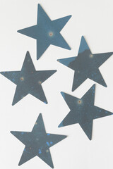 Fototapeta premium moody darkish paper stars on white