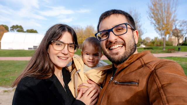 Happy family with baby enjoying outdoor time