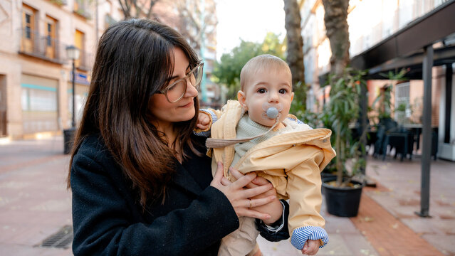 Mother enjoying time outdoors with her baby