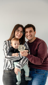 Family celebrating baby's 8-month milestone moment