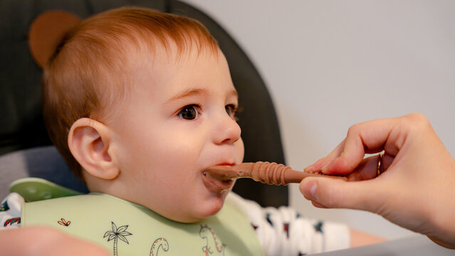 Baby enjoying food through baby led weaning method
