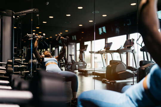 Hotel gym training with weights and cardio equipment