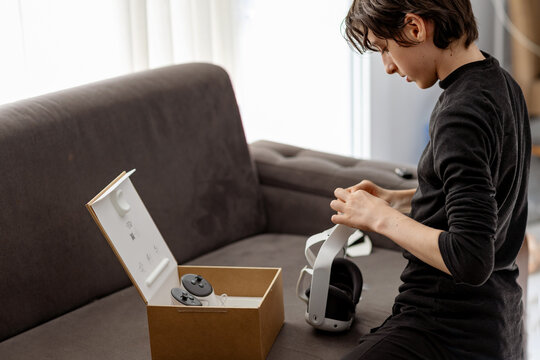 Teen boy with virtual reality headset setup