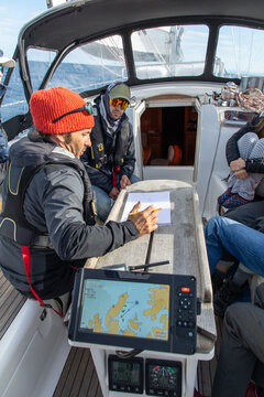 Sailors navigating waters around Lofoten Islands