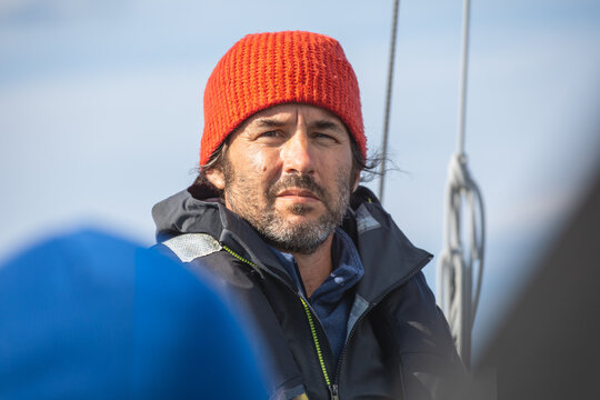 Sailor in Lofoten with Red Beanie and Blue Jacket