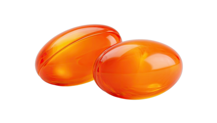 Two translucent, amber-colored oval gel capsules, isolated on black