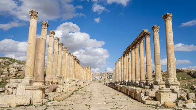 Ancient Roman colonnade in Jerash, Jordan under blue sky