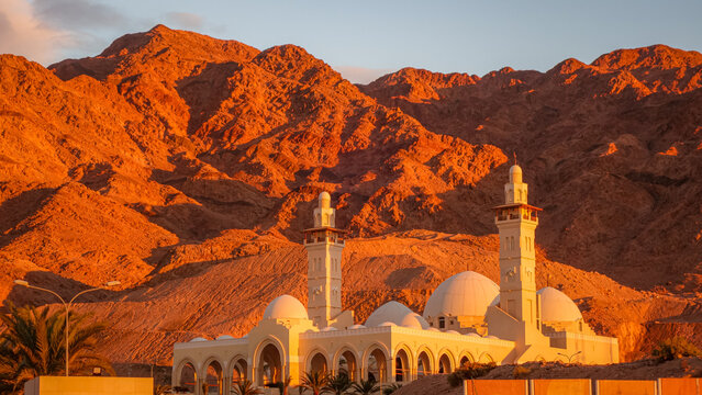 Sheikh Zayed Mosque with sunset mountains in Jordan