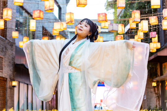 Elegant hanfu dress amidst glowing lanterns