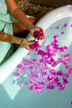 Relaxing bath with pink petals and soothing ambiance