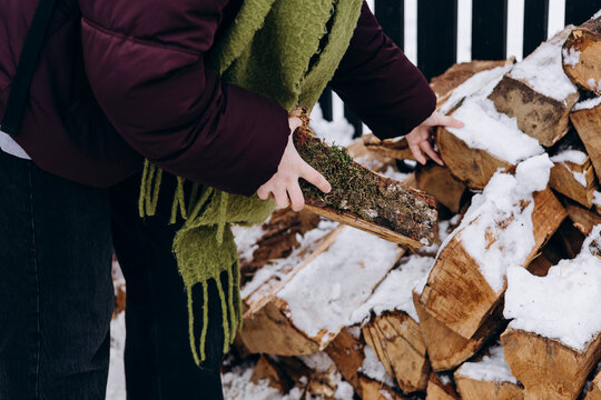 Collecting firewood on a snowy winter day