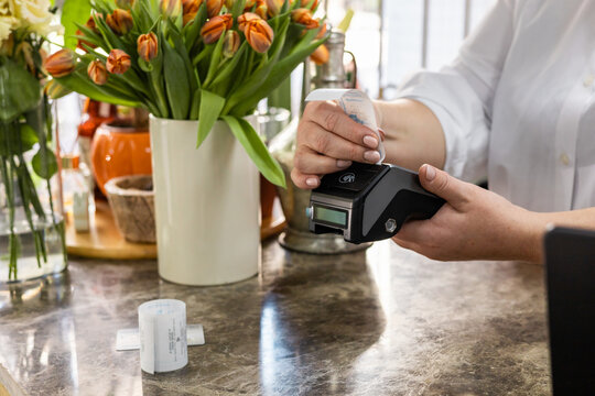 Flower shop small business using a card reader for transactions
