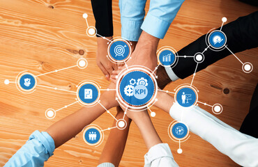This image depicts hands coming together to symbolize teamwork and collaboration, surrounded by KPI...