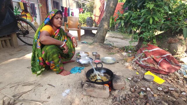 Rural Indian Woman Cooking Outdoors in Traditional Village Kitchen, Preparing Food on Wood Fire Chulha, Authentic Indian Lifestyle, Culture and Rural Life